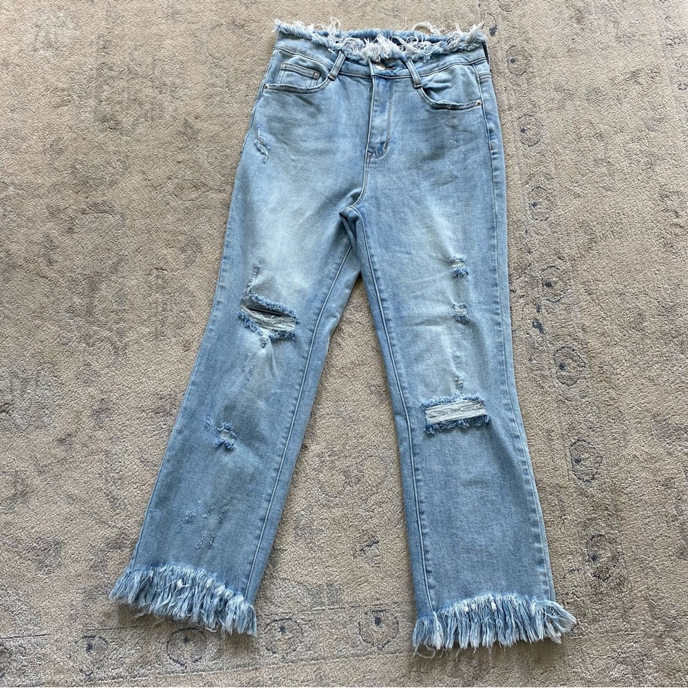 Light Wash Distressed Fringe Hem Women’s Jeans